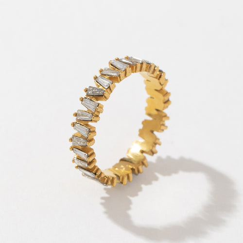 A golden stainless steel ring set with zirconium