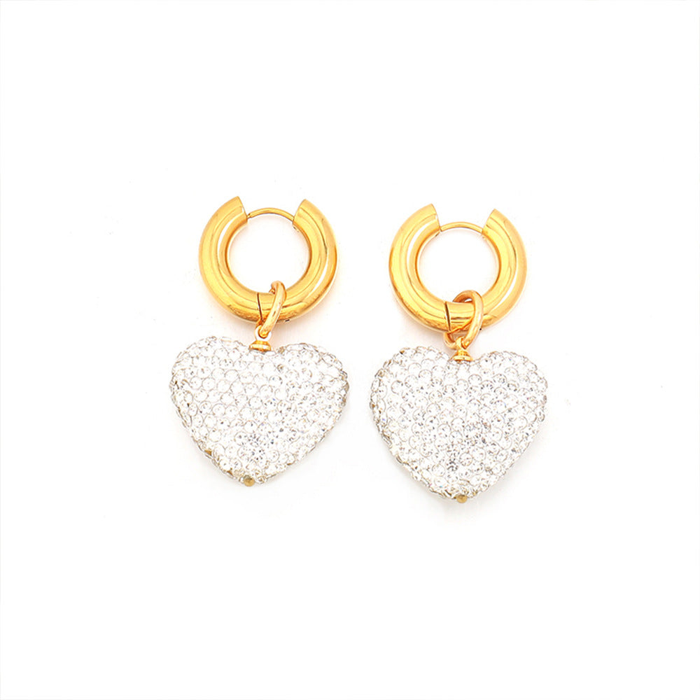 Diamond-encrusted three-dimensional heart pendant earrings