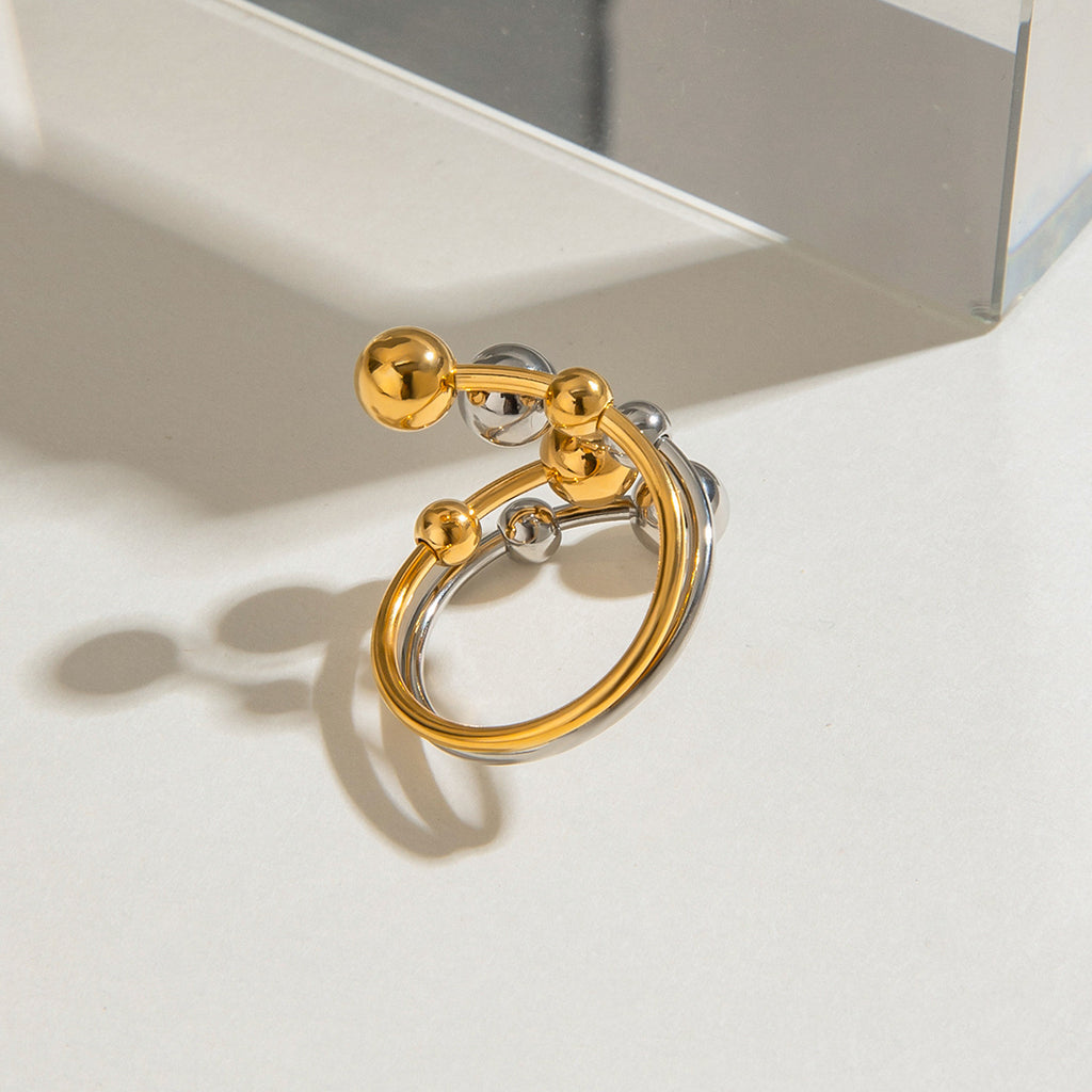 A double-layer ring made of stainless steel, gold and silver, with large and small steel balls