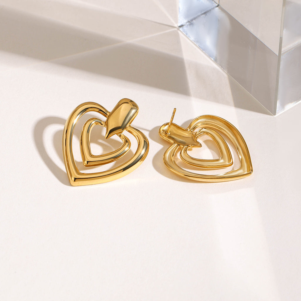Golden stainless steel heart-shaped perforated earrings