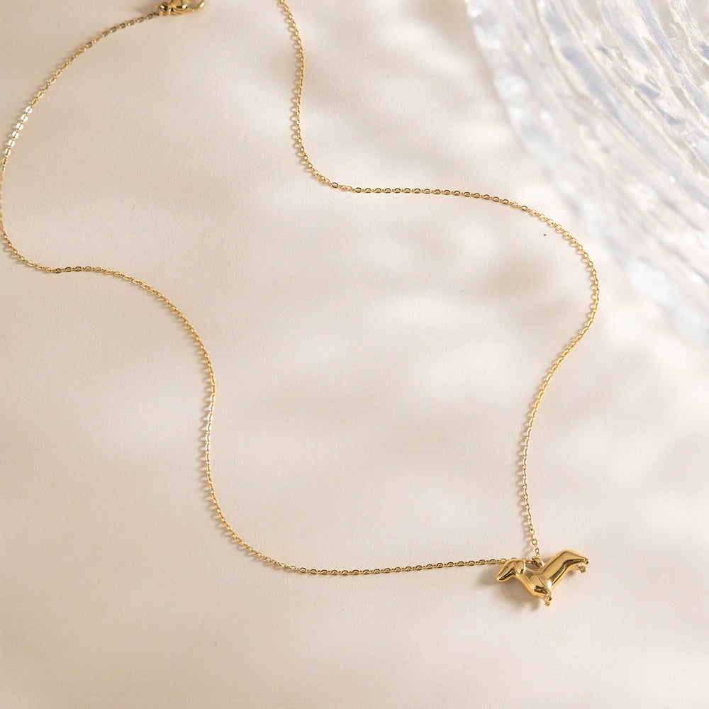 A cute golden stainless steel dog pendant necklace