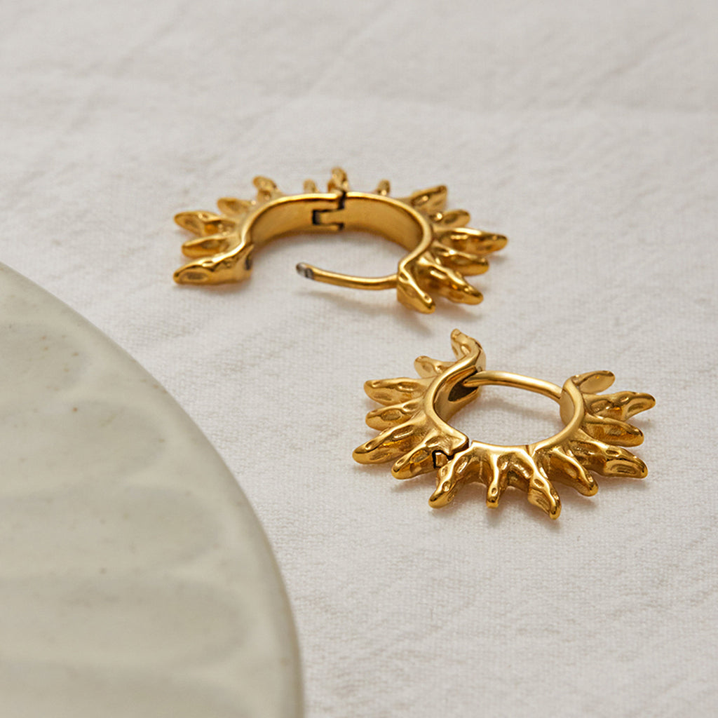 Golden stainless steel sunflower hollowed-out earrings