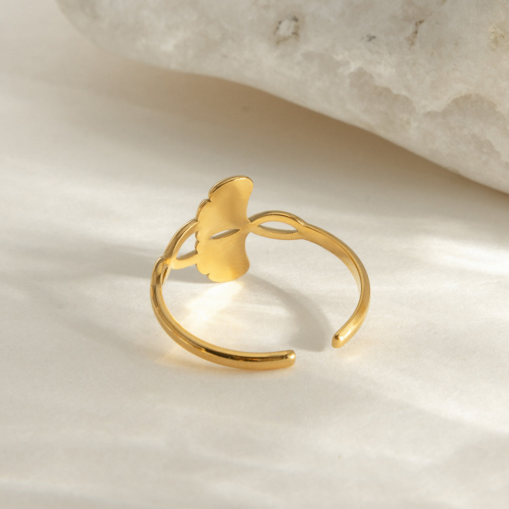 A stainless steel electroplated 18K gold line wound with ginkgo leaf adjustable opening ring