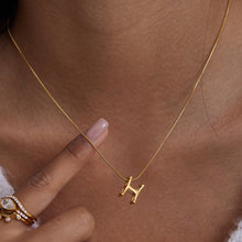 Load image into Gallery viewer, A golden stainless steel H-letter necklace