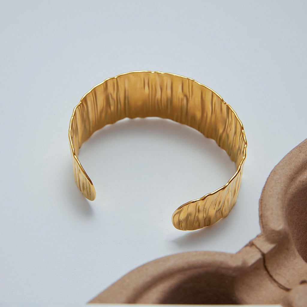 Golden stainless steel wide-faced bracelet